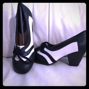 Classified black and white shoes with 1.5” heel